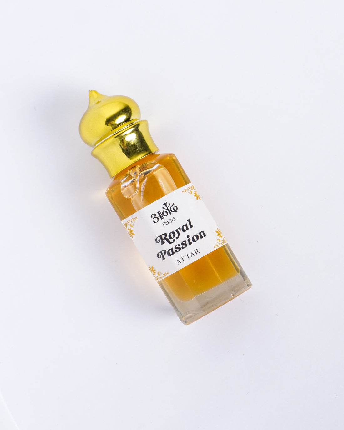Royal Passion Attar fragrance oil bottle displayed beside a Rasa-branded jute pouch