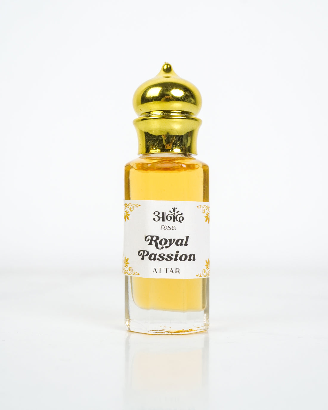 Anand Rosa Royal Passion Attar perfume oil in a clear glass bottle with a gold cap on a white background