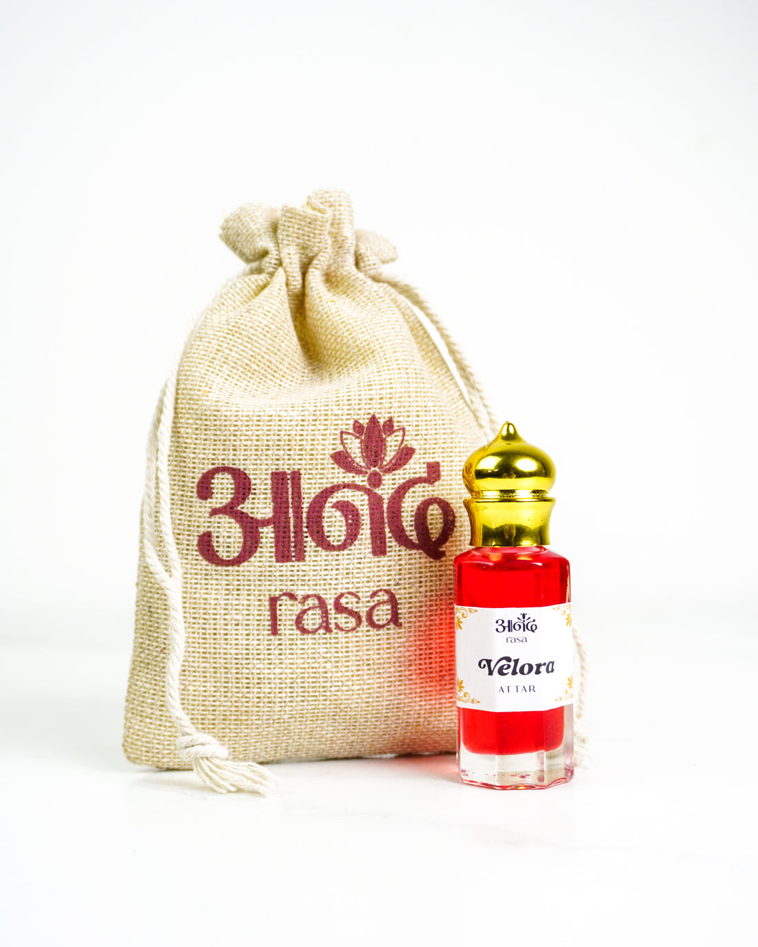 Indian Violet Attar perfume bottle with golden cap and Rasa-branded packaging